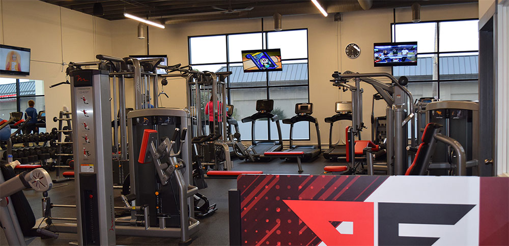Book A Tour Today | Point Fitness Club Gym Saskatoon - Personal Training & Fitness Studio Point Fitness Club gym interior in Saskatoon - book a tour for personal training and fitness programs